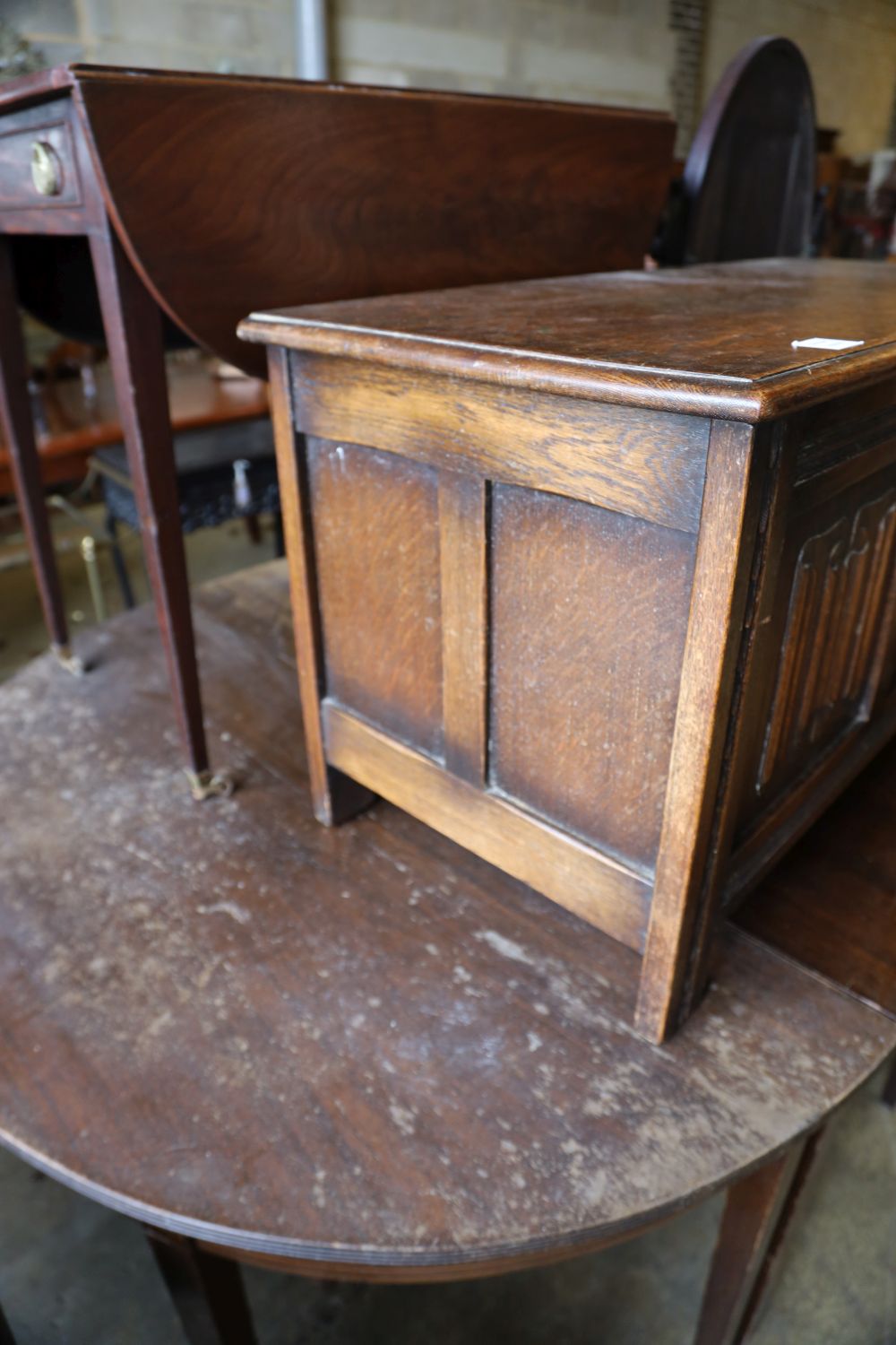 A reproduction oak linenfold coffer, width 104cm depth 45cm height 51cm